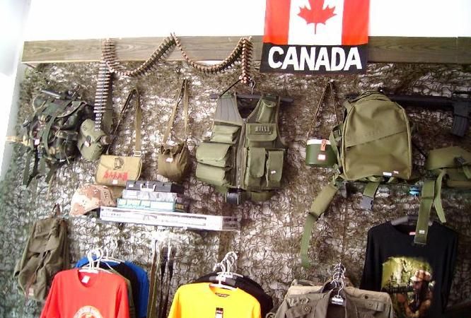 Owner of a military store, what is the name of a store that sells military clothing? Picture 1